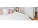 Comfortable bedroom with white textured bedding, soft pillows, and stylish white nightstand at 420 Heritage Park Nw Trce # 22, Kennesaw, GA 30144