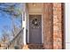 Charming front entrance with a gray door, brick exterior, and elegant floral wreath at 420 Heritage Park Nw Trce # 22, Kennesaw, GA 30144