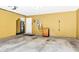 Spacious garage with yellow walls, concrete floor and utility storage, and a water heater at 420 Heritage Park Nw Trce # 22, Kennesaw, GA 30144