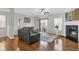 Inviting living room with hardwood floors, fireplace, and sliding doors to the outside at 420 Heritage Park Nw Trce # 22, Kennesaw, GA 30144