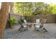 Cozy backyard featuring a gravel area, modern Adirondack chairs, and a central fire pit at 1308 Fairview Ne Rd, Atlanta, GA 30306