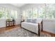 Bright bedroom with a daybed, hardwood floors, and large windows at 1308 Fairview Ne Rd, Atlanta, GA 30306