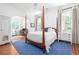 Elegant bedroom boasts a four-poster bed, hardwood floors, and an archway to an office at 1308 Fairview Ne Rd, Atlanta, GA 30306