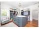 Spacious walk-in closet with custom shelving and a center island with drawers at 1308 Fairview Ne Rd, Atlanta, GA 30306