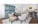 Dining room features a chandelier, blue cabinets and view into bar at 1308 Fairview Ne Rd, Atlanta, GA 30306
