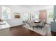 Dining room with chandelier, brick accent wall, and sliding doors to outdoors at 1308 Fairview Ne Rd, Atlanta, GA 30306
