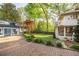 Beautiful home with a brick driveway, landscaped yard, and manicured garden at 1308 Fairview Ne Rd, Atlanta, GA 30306