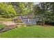 Charming home with a lush green lawn and beautiful landscaping, offering great curb appeal at 1308 Fairview Ne Rd, Atlanta, GA 30306
