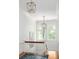 Bright hallway featuring chandeliers, a staircase, and a large window at 1308 Fairview Ne Rd, Atlanta, GA 30306