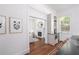 Bright kitchen transitions into living room with view of fireplace, and features wooden floors at 1308 Fairview Ne Rd, Atlanta, GA 30306