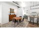 Open-concept space with a kitchen island, a round dining table, and eclectic decor at 1308 Fairview Ne Rd, Atlanta, GA 30306