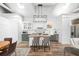 Elegant kitchen featuring an island, modern lighting, and stainless steel appliances at 1308 Fairview Ne Rd, Atlanta, GA 30306