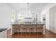 Bright kitchen features a large center island with seating, stainless appliances, and wooden floors at 1308 Fairview Ne Rd, Atlanta, GA 30306