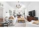 Bright living room with hardwood floors, built-in bookshelves, and comfortable white seating at 1308 Fairview Ne Rd, Atlanta, GA 30306