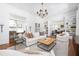 Open-concept living room with a fireplace, hardwood floors, and comfortable seating arrangement at 1308 Fairview Ne Rd, Atlanta, GA 30306