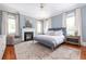 Serene main bedroom with fireplace, hardwood floors, and large windows at 1308 Fairview Ne Rd, Atlanta, GA 30306