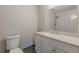 Bathroom features a modern vanity, ample counter space, and updated fixtures with gray flooring at 5001 Oakdale Dr, Douglasville, GA 30135