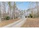 View of the home and long driveway surrounded by mature trees offering privacy and seclusion at 5001 Oakdale Dr, Douglasville, GA 30135