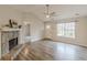 Bright living room with a stone fireplace, vaulted ceiling, and hardwood floors at 5001 Oakdale Dr, Douglasville, GA 30135