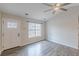 Bright and airy living room featuring high ceilings, large window and hardwood flooring at 5001 Oakdale Dr, Douglasville, GA 30135