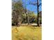 Expansive lawn with mature trees that create privacy and shade on the property at 917 Greymont Nw Cir, Marietta, GA 30064