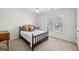 Bright bedroom with a full-sized bed, hardwood furniture, and a large window offering lots of light at 1345 Bridgemill Ave, Canton, GA 30114