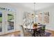 Charming dining room with hardwood floors, bright windows, and views of the deck at 1345 Bridgemill Ave, Canton, GA 30114