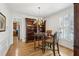 Elegant dining room with hardwood floors, wainscoting, a chandelier, and a built-in bookcase at 1345 Bridgemill Ave, Canton, GA 30114