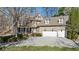 Stunning home with a three-car garage and well-manicured landscaping and inviting front porch at 1345 Bridgemill Ave, Canton, GA 30114
