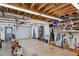 Spacious garage featuring an open ceiling, roll-up door, and ample storage, perfect for hobbies and projects at 1345 Bridgemill Ave, Canton, GA 30114