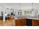 Gourmet kitchen with stainless appliances, an island cooktop, and views into the living room at 1345 Bridgemill Ave, Canton, GA 30114
