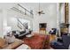 Open concept living room with soaring ceilings, a fireplace and views of the staircase at 1345 Bridgemill Ave, Canton, GA 30114