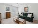 Comfortable living room featuring plush seating, elegant decor, and natural light from a large window at 1345 Bridgemill Ave, Canton, GA 30114