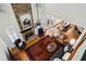 Open-concept living space with stone fireplace, soaring ceilings, hardwood floors, and abundant natural light at 1345 Bridgemill Ave, Canton, GA 30114