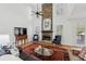 Spacious living room showcasing a floor to ceiling stone fireplace and natural light throughout at 1345 Bridgemill Ave, Canton, GA 30114