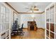 Bright office space with hardwood floors, ample desk space, and built-in shelves with natural light at 1345 Bridgemill Ave, Canton, GA 30114