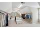 Large walk-in closet with custom shelving, ample storage, carpet flooring and lots of natural light at 1345 Bridgemill Ave, Canton, GA 30114