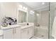 Bright bathroom with double vanity with granite countertops and glass shower enclosure at 345 Glen Iris Ne Dr # 5, Atlanta, GA 30312