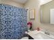 Cozy bathroom featuring a vanity with stone countertop, and a shower with a stylish patterned curtain at 345 Glen Iris Ne Dr # 5, Atlanta, GA 30312