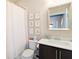 Bright bathroom featuring a vanity, toilet and bathtub with shower at 345 Glen Iris Ne Dr # 5, Atlanta, GA 30312