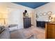 Cozy Bedroom with blue ceiling, gray sofa, dark dresser and changing table at 345 Glen Iris Ne Dr # 5, Atlanta, GA 30312