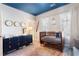 Bright Bedroom with wooden crib, dresser, and white shuttered windows at 345 Glen Iris Ne Dr # 5, Atlanta, GA 30312