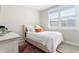 Bright bedroom featuring neutral tones, a comfortable bed, and a large window with plantation shutters at 345 Glen Iris Ne Dr # 5, Atlanta, GA 30312