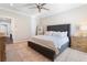 Bedroom features a tufted headboard, neutral walls, a ceiling fan and carpet floors at 345 Glen Iris Ne Dr # 5, Atlanta, GA 30312