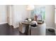 Cozy dining area with dark hardwood floors, modern lighting, and elegant decor at 345 Glen Iris Ne Dr # 5, Atlanta, GA 30312