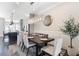 Formal dining room with stylish light fixture, seating for six, and views into the kitchen at 345 Glen Iris Ne Dr # 5, Atlanta, GA 30312