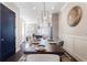 Elegant dining room featuring a long table, seating for eight, and stylish decor at 345 Glen Iris Ne Dr # 5, Atlanta, GA 30312