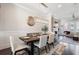 Elegant dining room with stylish lighting, seating for six, and hardwood flooring at 345 Glen Iris Ne Dr # 5, Atlanta, GA 30312