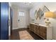 Stylish foyer with modern barn door, white accents, diamond mirrors, and decorative console table at 345 Glen Iris Ne Dr # 5, Atlanta, GA 30312