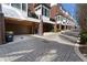 Street view of townhomes featuring attached garages and red brick exterior at 345 Glen Iris Ne Dr # 5, Atlanta, GA 30312